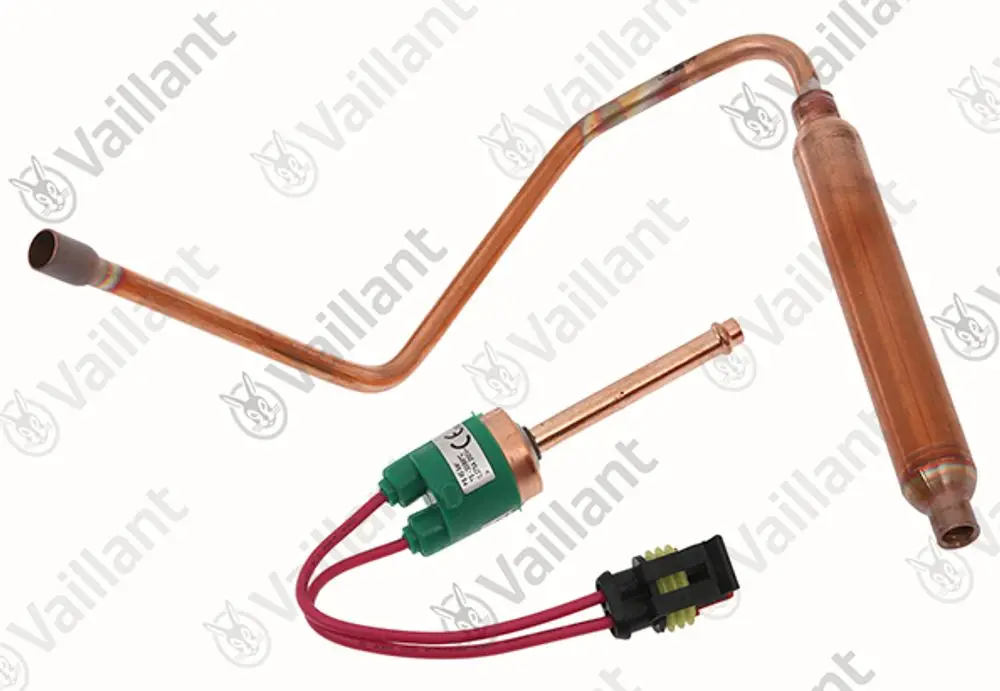 Vaillant-Hochdruckschalter mit Kupferrohren, einer grünen Einheit mit Kabelanschlüssen und einem zylindrischen Element. Gepresstes Metallteil an einer Seite sichtbar.